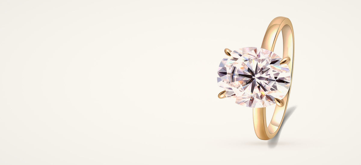 Oval lab-created moissanite solitaire ring in yellow gold