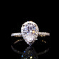 1.5 carat pear cut moissanite warp halo ring
